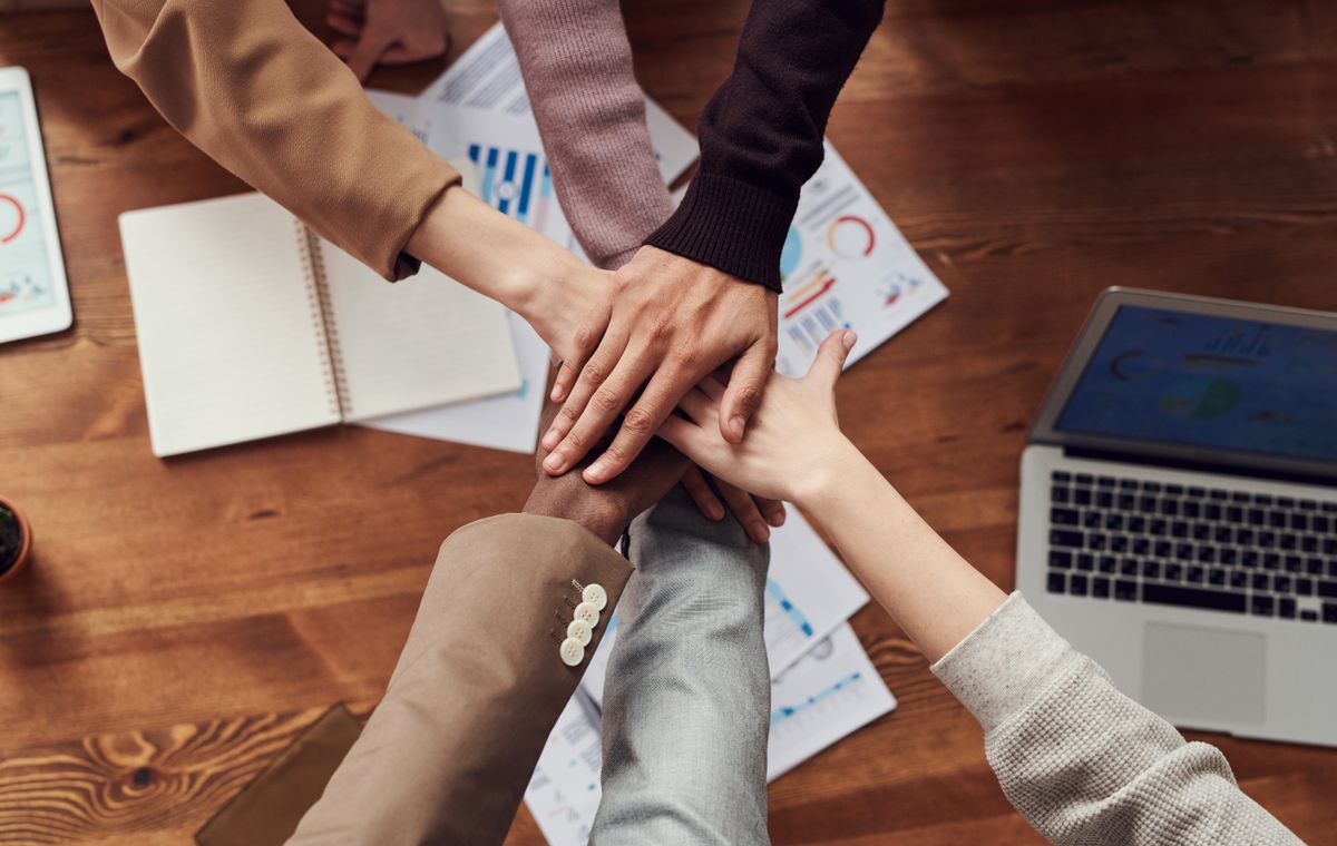 An agency team working through a client campaign together